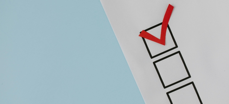 Minimalist checklist with a red checkmark on a blue and white background.