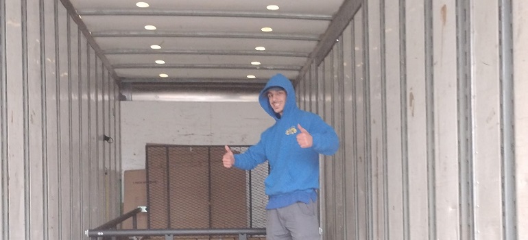 a worker from an Athol MA moving company in a storage unit
