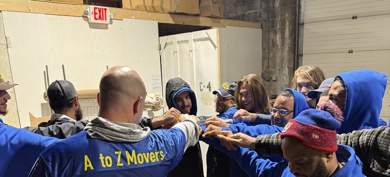 a team of professional pool table movers Massachusetts preparing for a moving project