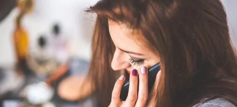 A woman learning how to update the address after moving to Massachusetts